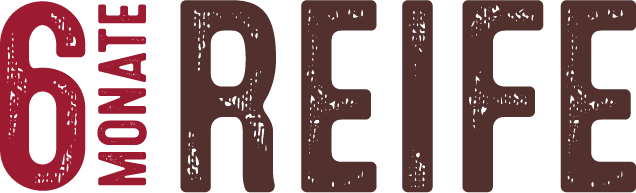 Der Schriftzug zeigt die Worte '6 Monate' in roter Farbe und 'REIFE' in brauner Farbe, was auf einen Reifungsprozess hinweist.